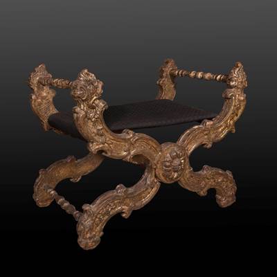 An important carved and gilded wood stool, Rome, middle of 17th century (70 cm wide, 56 cm deep, 65 cm high, 45 cm high for seating) (28 in. wide, 22 in. deep, 26 in. high, 18 in. high for seating)