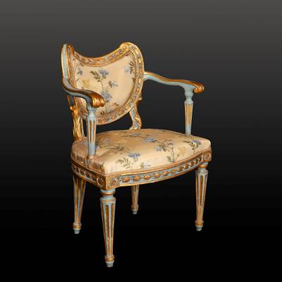 An exceptional painted and gilded musician armchair, Venice, second half 18th century (85 cm high, 60 cm wide, 50 cm deep) (33 in. high, 23 in. wide, 20 in. deep)