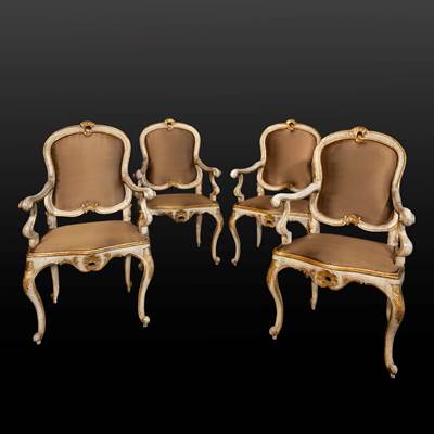 A set of 4 lacquered and gilded armchairs, North of Italy (Lombardo - Veneto), 18th century (104 cm high, 64 cm wide, 62 cm deep) (41 in. high, 25 in. wide, 24 in. deep)