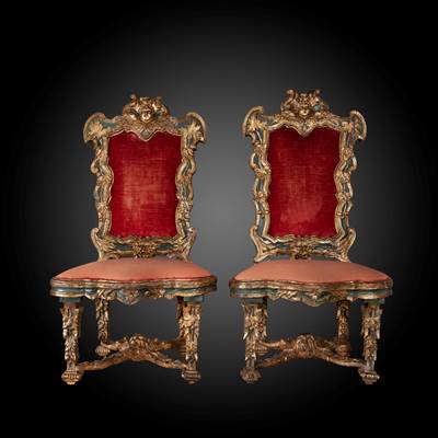 An exceptional pair of gilded, carved wood and painted chairs, with a vegetal and 