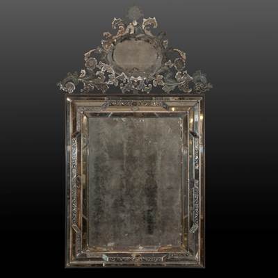 An important rectangular mirror with its top, Murano, Venice, Italy, early 18th century (204 cm high, 105 cm wide) (80 in. high, 41 in. wide)