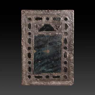 A precious silver small mirror, Persian work, late 18th century/early 19th century (30 cm high, 21 cm wide) (12 in. high, 8 in. wide)
