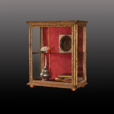 A gilded wood display cabinet, Italy, 18th century (53 cm high, 43 cm wide, 24 cm deep) (21 in. high, 17 in. wide, 9 in. deep)
