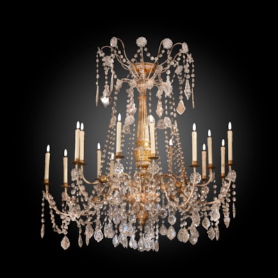 An ivory painted and gilded chandelier, 15 arms of light, central part in carved wood, Genoa, Italy, late 18th century (130 cm high, 130 cm wide) (51 in. high, 51 in. wide)