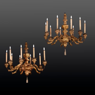 A pair of carved and gilded wood chandeliers, with numerous arms of light, Tuscany, Italy, 18th century (70 cm high, 70 cm diameter) (28 in. high, 28 in. diameter)