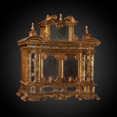 A precious gilded cabinet, with small mirrors decoration, Italy, late 17th century (71 cm high, 69 cm wide, 20 cm deep) (28 in. high, 27 in. wide, 8 in. deep)